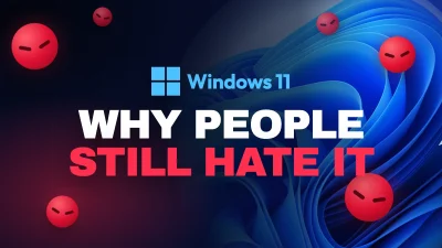 Windows 11 logo on blue wallpaper surrounded by scowling red faces